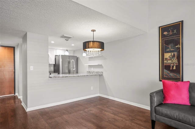2581 Countryside Blvd Unit 2309, Clearwater, FL 33761 - unfurnished room with dark wood-style flooring, baseboards, a textured ceiling, and recessed lighting