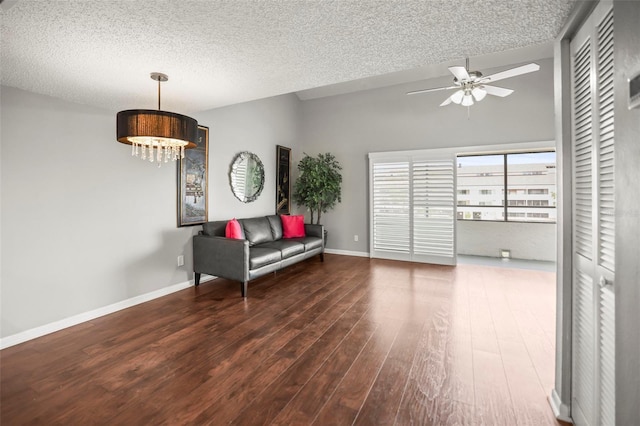 2581 Countryside Blvd Unit 2309, Clearwater, FL 33761 - living area with ceiling fan, wood finished floors, a chandelier, a textured ceiling, and baseboards