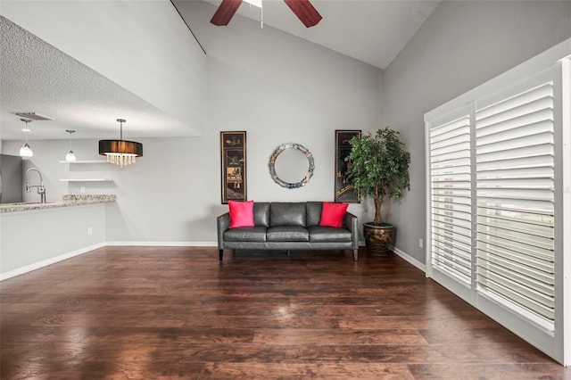 2581 Countryside Blvd Unit 2309, Clearwater, FL 33761 - living area with ceiling fan, wood finished floors, baseboards, and high vaulted ceiling