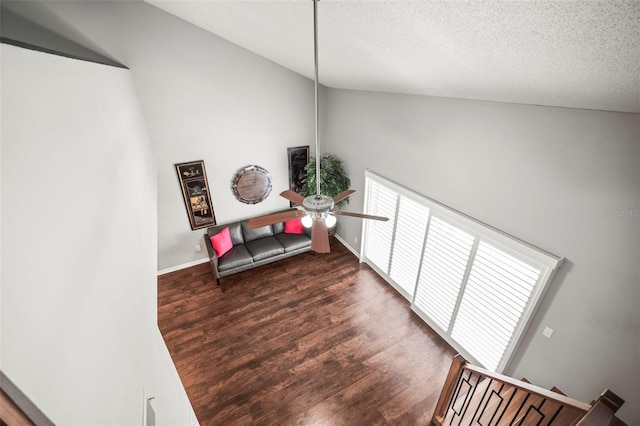 2581 Countryside Blvd Unit 2309, Clearwater, FL 33761 - living area with a ceiling fan, wood finished floors, a textured ceiling, and baseboards