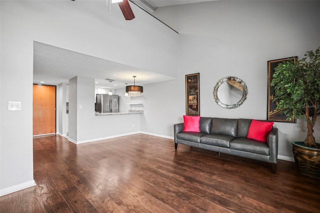 2581 Countryside Blvd Unit 2309, Clearwater, FL 33761 - living room featuring wood finished floors, baseboards, a ceiling fan, and a towering ceiling