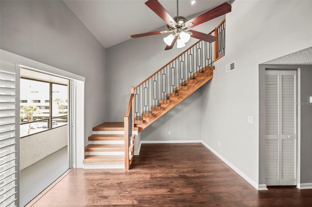 2581 Countryside Blvd Unit 2309, Clearwater, FL 33761 - staircase featuring a ceiling fan, wood finished floors, high vaulted ceiling, and baseboards