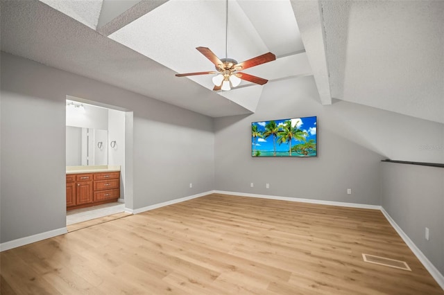 2581 Countryside Blvd Unit 2309, Clearwater, FL 33761 - bonus room featuring light wood-style floors, a ceiling fan, baseboards, and a textured ceiling