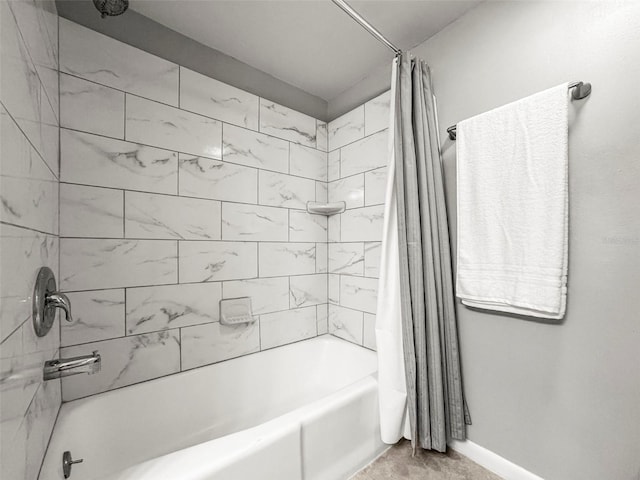 2581 Countryside Blvd Unit 2309, Clearwater, FL 33761 - bathroom featuring shower / bathtub combination with curtain and baseboards