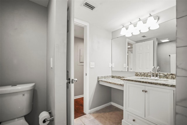 2581 Countryside Blvd Unit 2309, Clearwater, FL 33761 - bathroom featuring vanity, toilet, tile patterned flooring, and baseboards