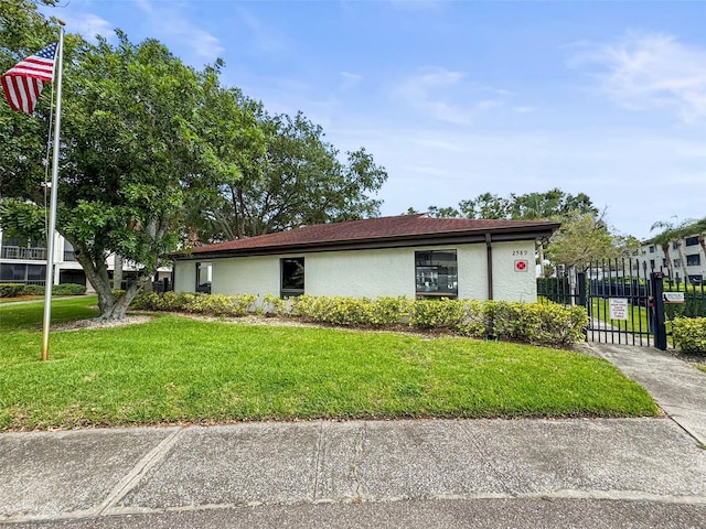 2581 Countryside Blvd Unit 2309, Clearwater, FL 33761 - view of front facade featuring stucco siding and a gate