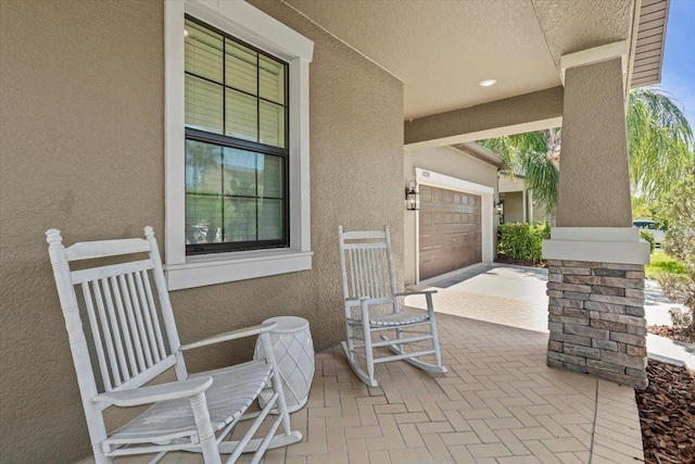 32193 Watoga Loop, Wesley Chapel, FL 33543 - view of patio featuring an attached garage