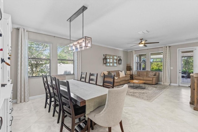 32193 Watoga Loop, Wesley Chapel, FL 33543 - dining area featuring crown molding, a ceiling fan, and light tile patterned flooring