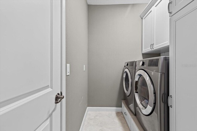 32193 Watoga Loop, Wesley Chapel, FL 33543 - laundry area with washing machine and clothes dryer and cabinet space