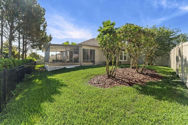 32193 Watoga Loop, Wesley Chapel, FL 33543 - back of property with a sunroom, a fenced backyard, and stucco siding