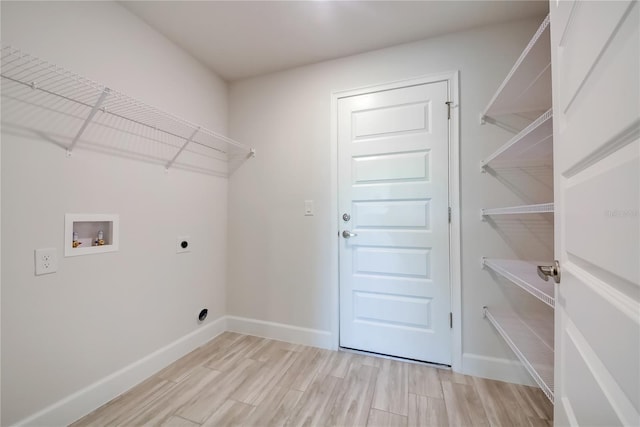 16508 66th Ln E, Parrish, FL 34219 - laundry area featuring electric dryer hookup, hookup for a washing machine, baseboards, and light wood finished floors
