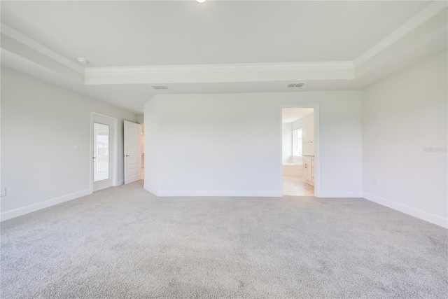 16508 66th Ln E, Parrish, FL 34219 - unfurnished room featuring a tray ceiling, crown molding, carpet flooring, baseboards, and plenty of natural light