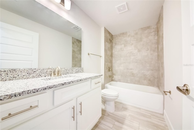 16508 66th Ln E, Parrish, FL 34219 - bathroom featuring toilet, vanity, and shower / washtub combination