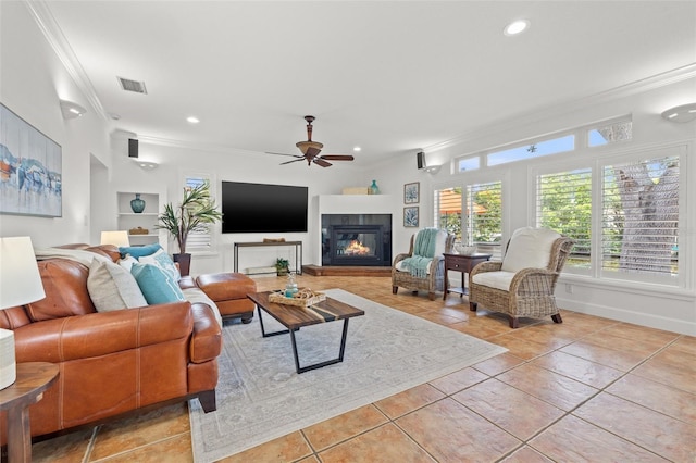 715 45th Ave NE, Saint Petersburg, FL 33703 - living area featuring ornamental molding, ceiling fan, light tile patterned floors, a glass covered fireplace, and recessed lighting