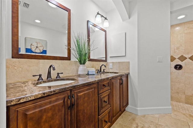 715 45th Ave NE, Saint Petersburg, FL 33703 - full bath with double vanity, tasteful backsplash, tiled shower, stone finish flooring, and recessed lighting