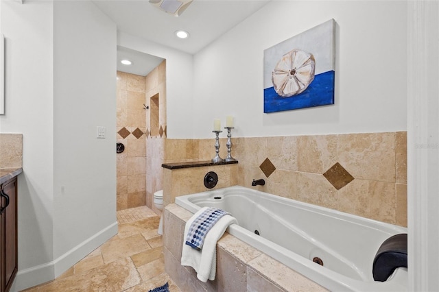 715 45th Ave NE, Saint Petersburg, FL 33703 - full bath featuring a whirlpool tub, vanity, a tile shower, stone tile floors, and recessed lighting
