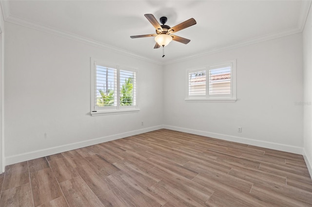 715 45th Ave NE, Saint Petersburg, FL 33703 - empty room featuring healthy amount of natural light, light wood-style flooring, ornamental molding, and a ceiling fan