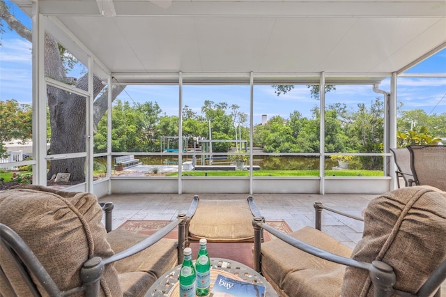 715 45th Ave NE, Saint Petersburg, FL 33703 - sunroom / solarium featuring view of wooded area