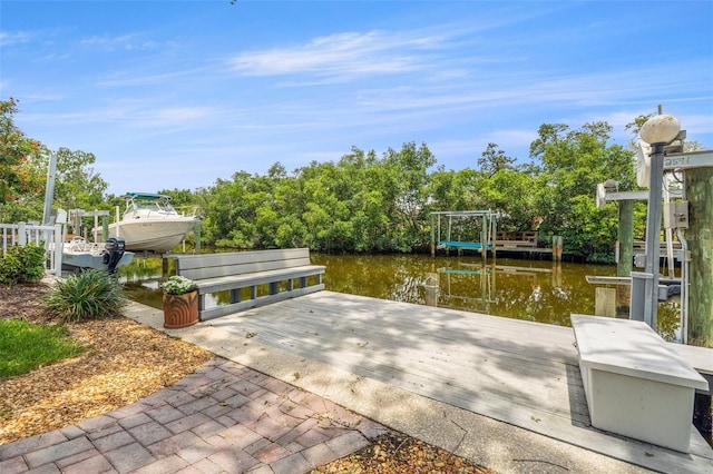 715 45th Ave NE, Saint Petersburg, FL 33703 - dock area with a water view and view of scattered trees