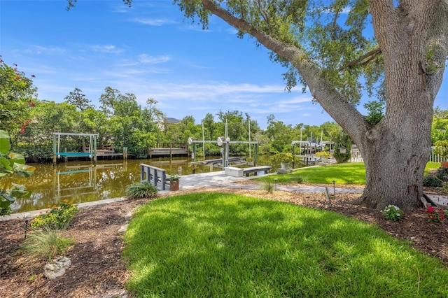 715 45th Ave NE, Saint Petersburg, FL 33703 - view of green lawn featuring boat lift, a boat dock, and a water view
