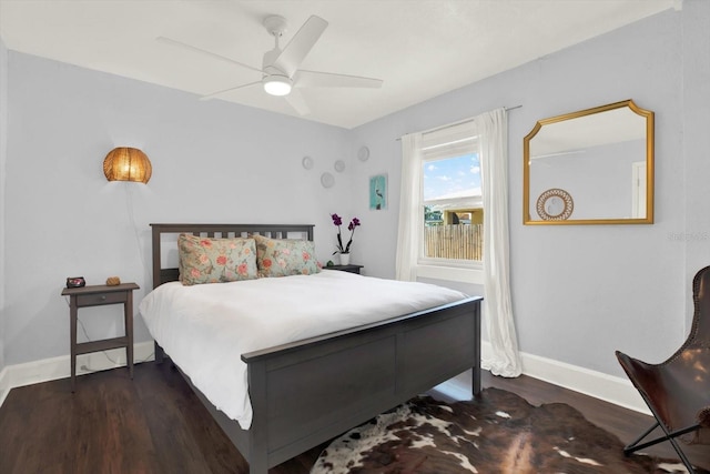 3230 4th Ave S, Saint Petersburg, FL 33712 - bedroom with dark wood-style flooring, baseboards, and a ceiling fan