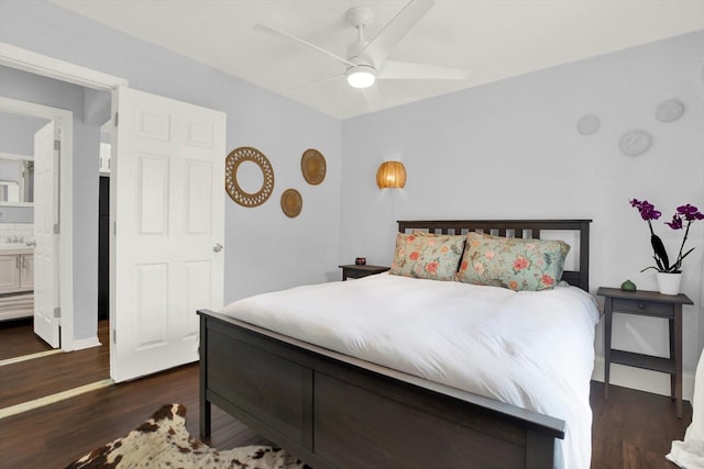 3230 4th Ave S, Saint Petersburg, FL 33712 - bedroom featuring wood finished floors, connected bathroom, and a ceiling fan