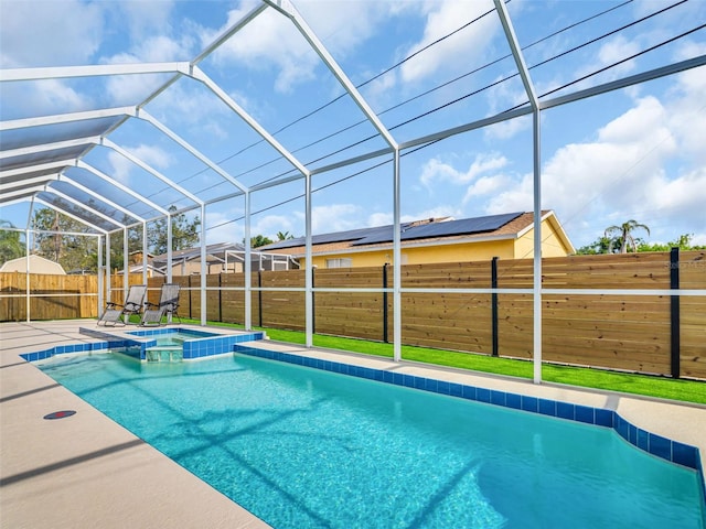 1102 Goshen Rd, Tarpon Springs, FL 34689 - view of pool with a fenced backyard, a lanai, a pool with connected hot tub, and a patio