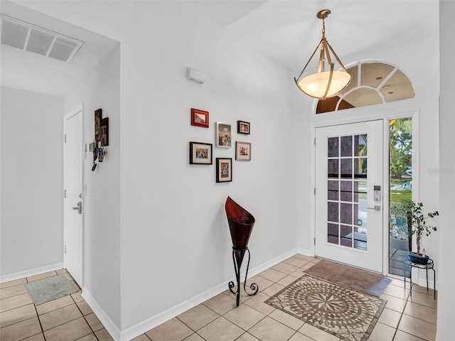 1102 Goshen Rd, Tarpon Springs, FL 34689 - foyer featuring light tile patterned flooring and baseboards