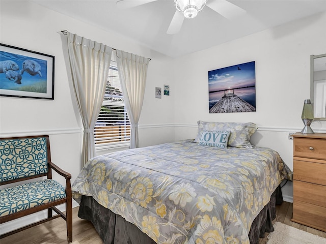 1102 Goshen Rd, Tarpon Springs, FL 34689 - bedroom featuring wood finished floors and ceiling fan
