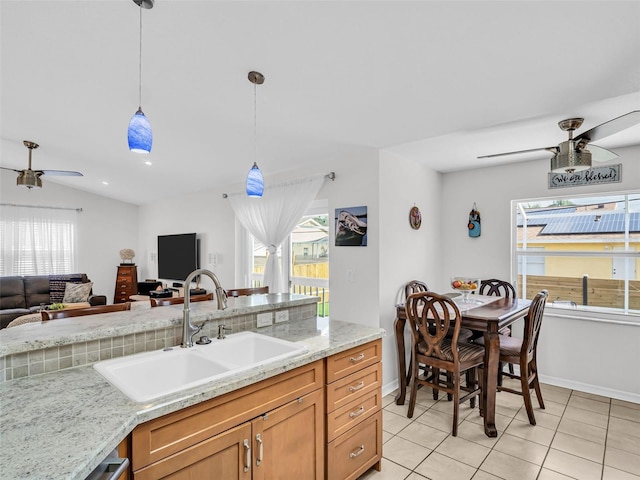 1102 Goshen Rd, Tarpon Springs, FL 34689 - kitchen with ceiling fan, a sink, open floor plan, light tile patterned floors, and plenty of natural light
