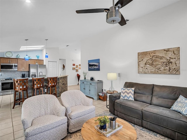 1102 Goshen Rd, Tarpon Springs, FL 34689 - living area featuring lofted ceiling, light tile patterned flooring, and ceiling fan
