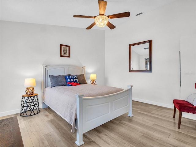 1102 Goshen Rd, Tarpon Springs, FL 34689 - bedroom with light wood-style flooring, baseboards, and ceiling fan
