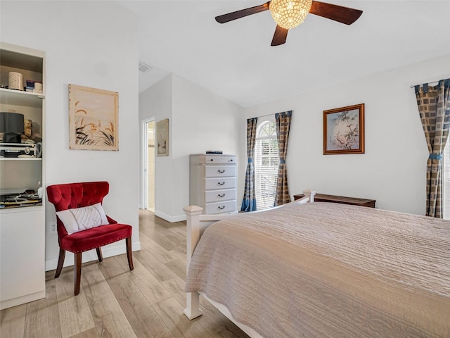 1102 Goshen Rd, Tarpon Springs, FL 34689 - bedroom with vaulted ceiling, wood finished floors, ceiling fan, and baseboards