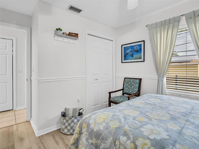 1102 Goshen Rd, Tarpon Springs, FL 34689 - bedroom with wood finished floors, a closet, baseboards, and ceiling fan