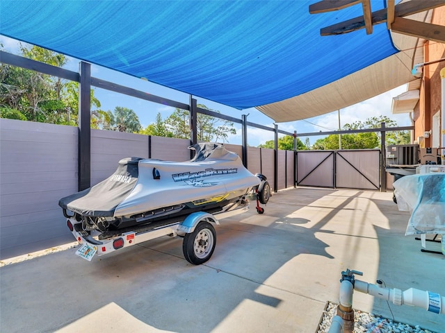 1102 Goshen Rd, Tarpon Springs, FL 34689 - view of patio / terrace with a gate and central AC