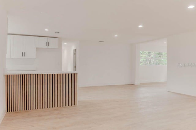 1255 Pine St, Altamonte Springs, FL 32701 - unfurnished room with light wood-style floors, recessed lighting, a dry bar, and baseboards
