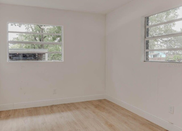 1255 Pine St, Altamonte Springs, FL 32701 - empty room with light wood finished floors and baseboards