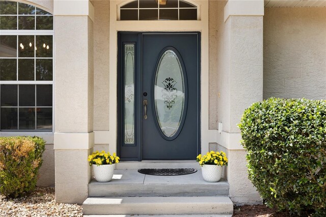 9700 SW 196th Cir, Dunnellon, FL 34432 - property entrance featuring stucco siding