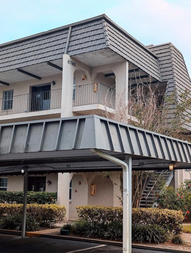 8765 Bardmoor Blvd Unit 108, Seminole, FL 33777 - view of property featuring stairway