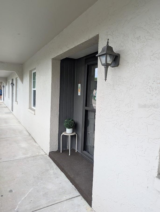 8765 Bardmoor Blvd Unit 108, Seminole, FL 33777 - property entrance with stucco siding
