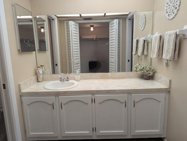 8765 Bardmoor Blvd Unit 108, Seminole, FL 33777 - bathroom with vanity and a spacious closet