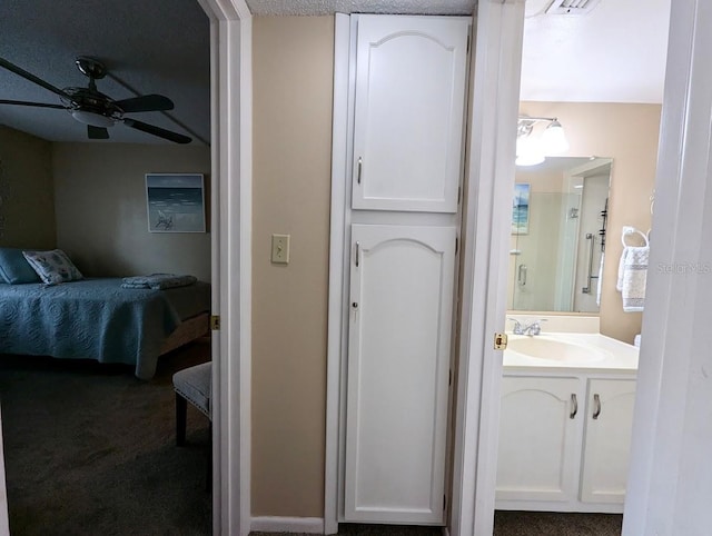 8765 Bardmoor Blvd Unit 108, Seminole, FL 33777 - bathroom featuring connected bathroom, a ceiling fan, and vanity