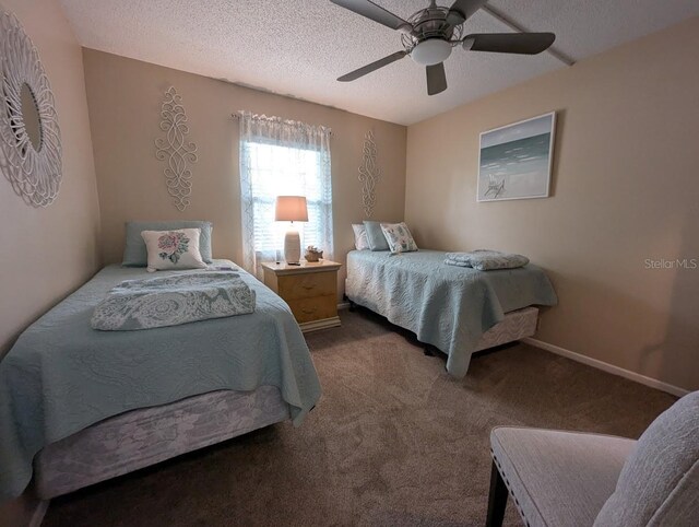 8765 Bardmoor Blvd Unit 108, Seminole, FL 33777 - carpeted bedroom featuring a textured ceiling and a ceiling fan