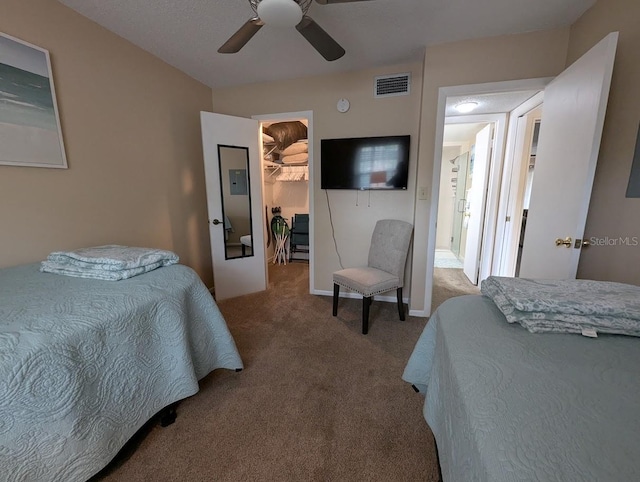 8765 Bardmoor Blvd Unit 108, Seminole, FL 33777 - carpeted bedroom featuring a walk in closet, a ceiling fan, and a closet