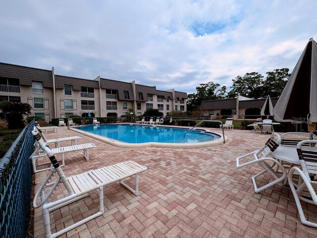 8765 Bardmoor Blvd Unit 108, Seminole, FL 33777 - community pool featuring a patio