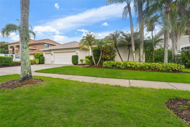 9402 Woodbay Dr, Tampa, FL 33626 - view of front of home featuring stucco siding, concrete driveway, a front lawn, and a garage