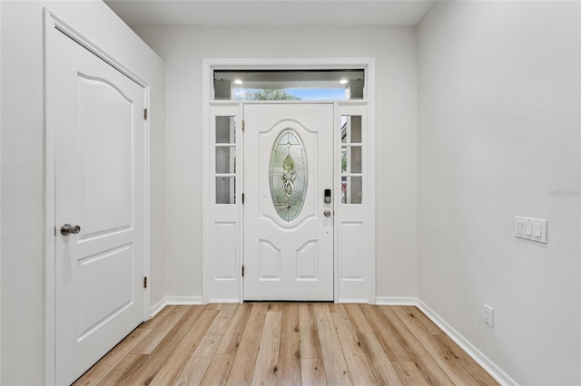 9402 Woodbay Dr, Tampa, FL 33626 - entrance foyer featuring light wood finished floors and baseboards