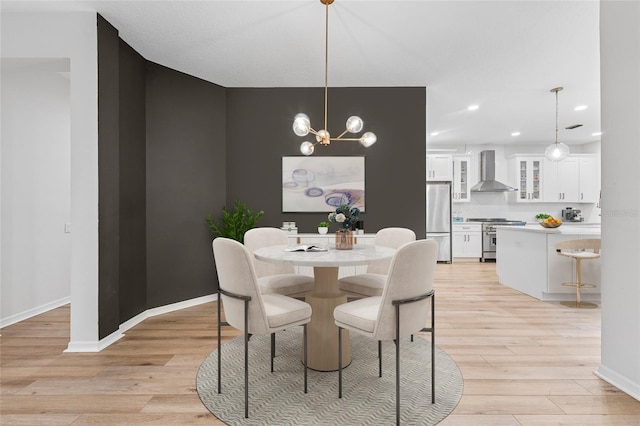 9402 Woodbay Dr, Tampa, FL 33626 - dining room with light wood finished floors, recessed lighting, baseboards, and a chandelier