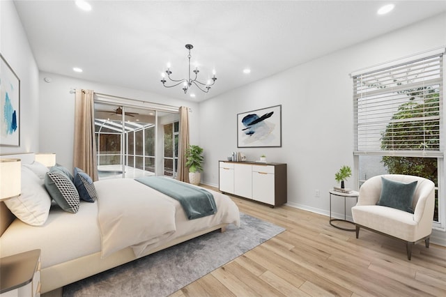 9402 Woodbay Dr, Tampa, FL 33626 - bedroom with recessed lighting, light wood-style floors, a chandelier, and baseboards