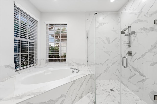 9402 Woodbay Dr, Tampa, FL 33626 - full bath with a marble finish shower, a bath, and recessed lighting